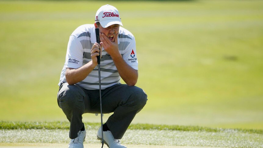 Another win ... Marc Leishman lines up his putt on the fifth hole