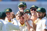 Jhye Richardson is mobbed by his Australian cricket teammates, who muss his hair during the first Test against Sri Lanka.