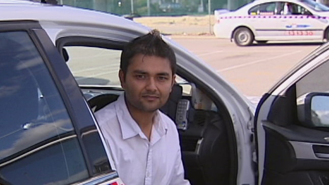 Taxi driver Rahul Puri in his cab.