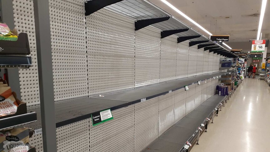 A supermarket aisle stripped bare.