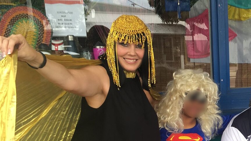 Yolande dressed as Cleopatra with a group in dress up including super woman