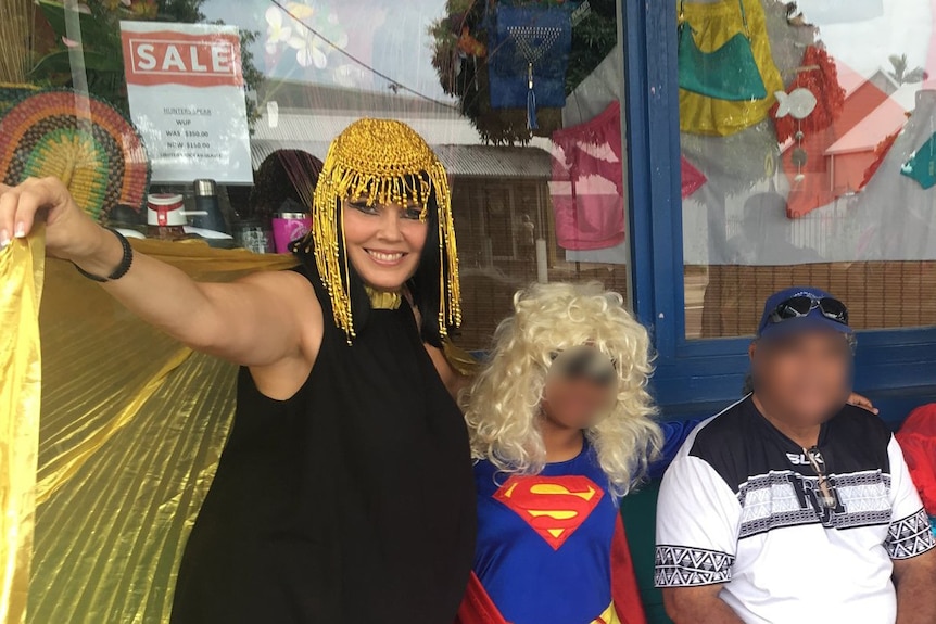 Yolande dressed as Cleopatra with a group in dress up including super woman
