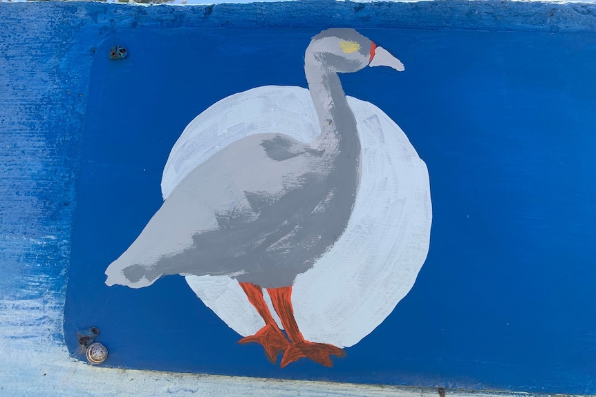 A painting of a grey goose standing in front of the moon