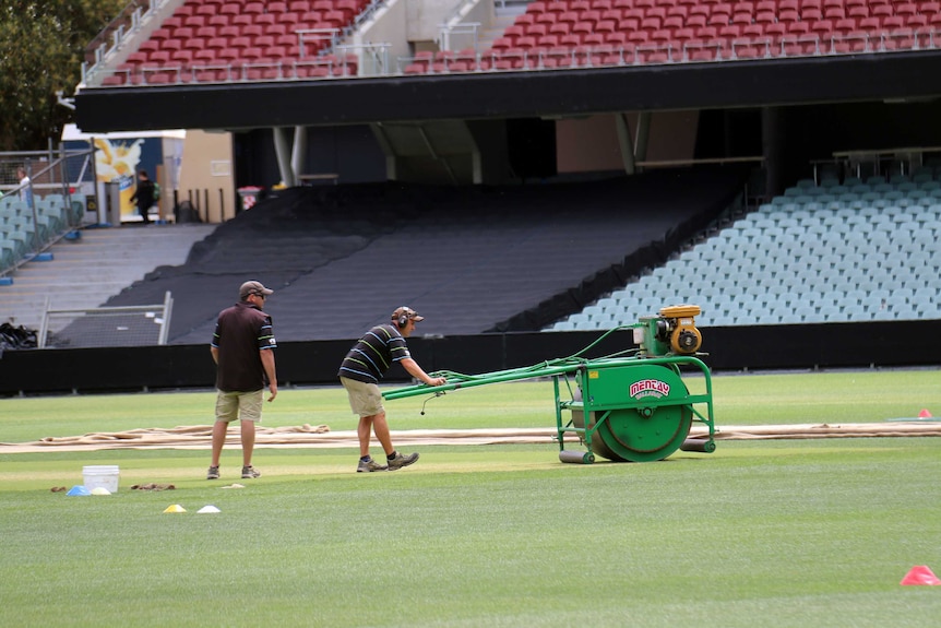 Groundsman Damian Hough prepares the pitch at Adelaide Oval