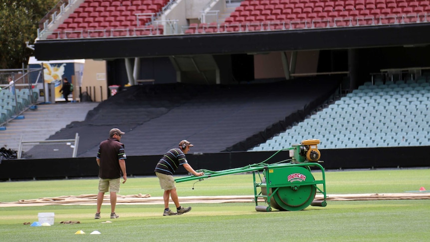 Groundsman Damian Hough prepares the pitch at Adelaide Oval
