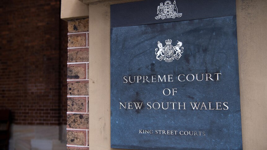 A sign which reads "Supreme Court of New South Wales, Kings Street Courts"