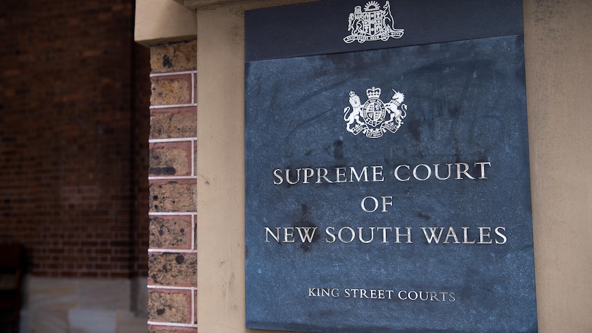 A sign which reads "Supreme Court of New South Wales, Kings Street Courts"