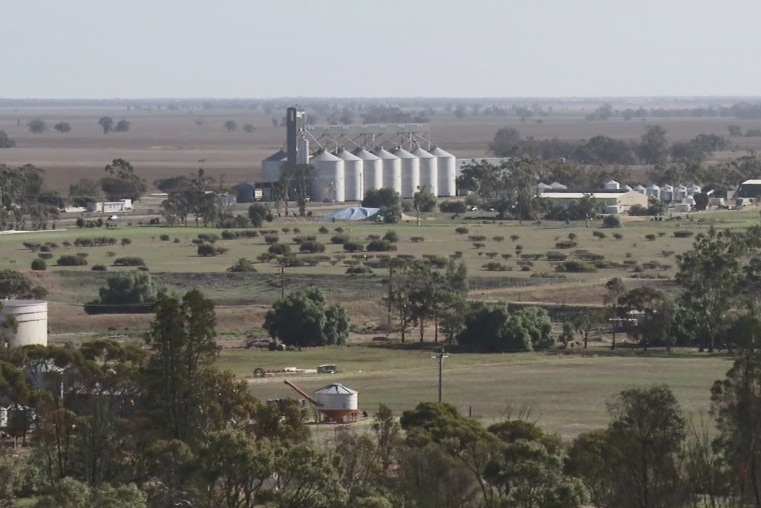 Landscape with silos featuring