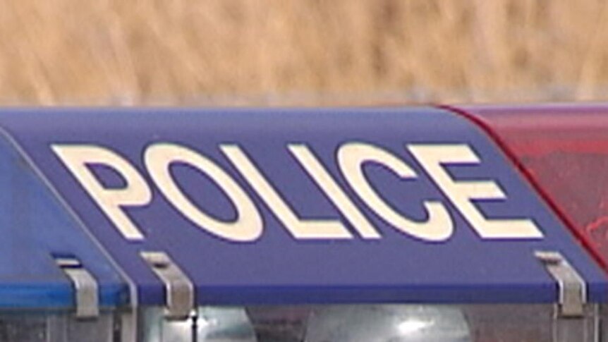 Close up of NSW Police sign and light from top of police car.