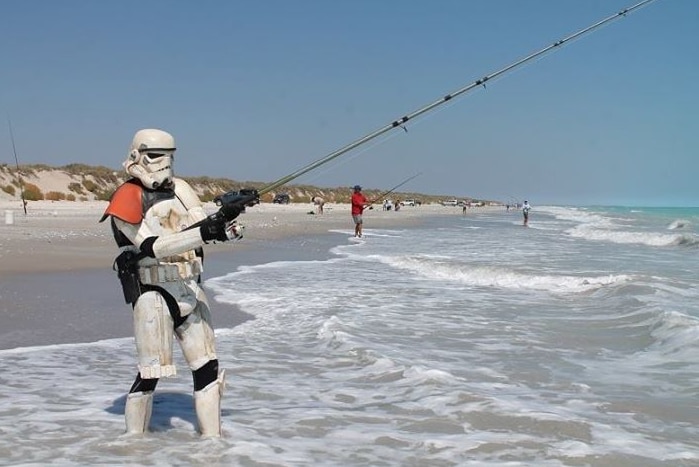 Scott Loxley dressed as a storm trooper, does a spot of fishing off Broome.