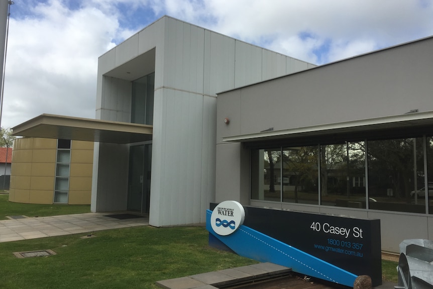 exterior of an office building with a sign out the front