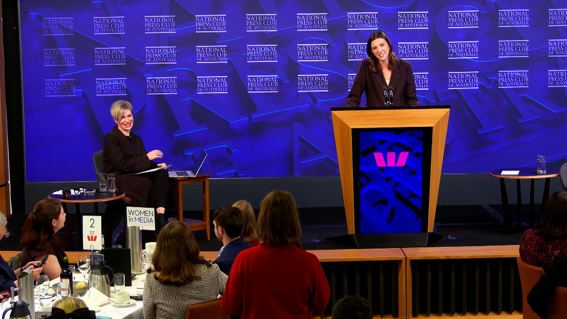 A late twenties woman addresses the National Press club, annoucing her plans to run for the Senate.