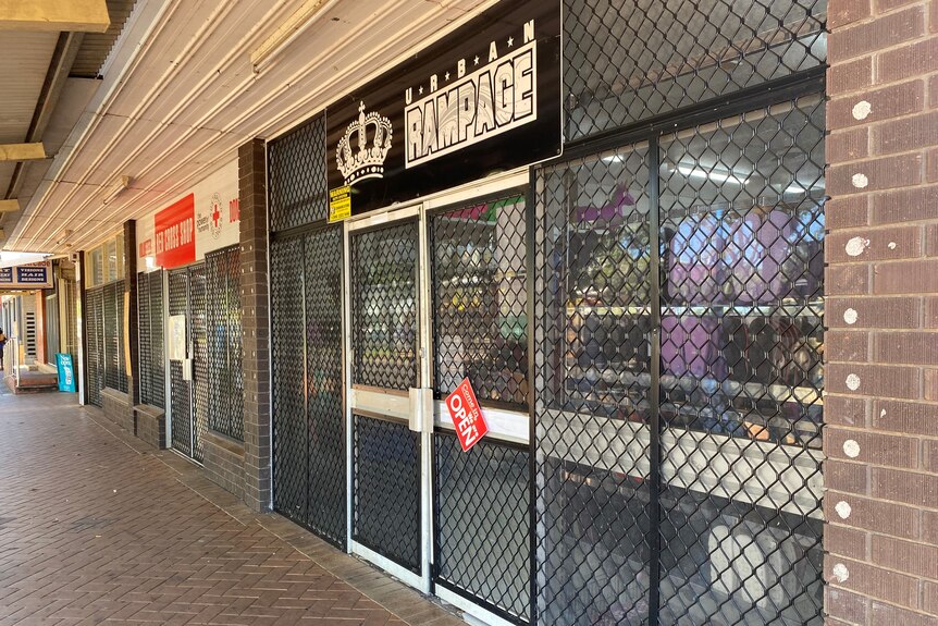 a business covered with mesh fencing
