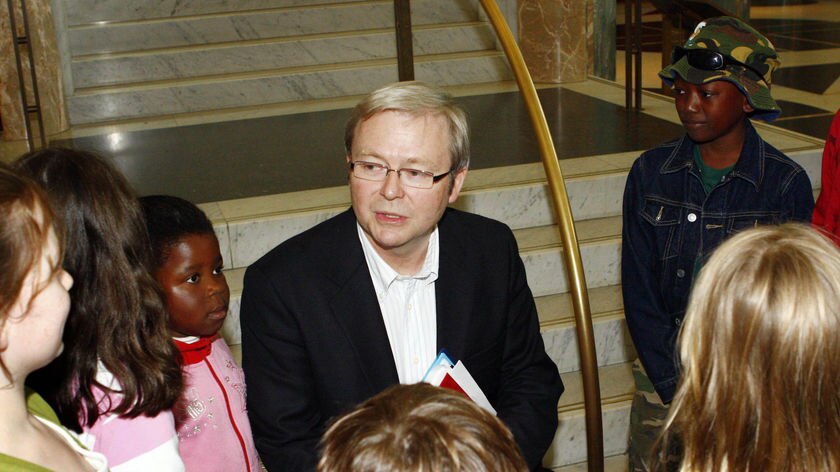 Prime Minister Kevin Rudd meets some children on the last day of the 2020 summit