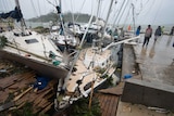 Several boats are cracked and damaged in the wake of a Tropical Cyclone.