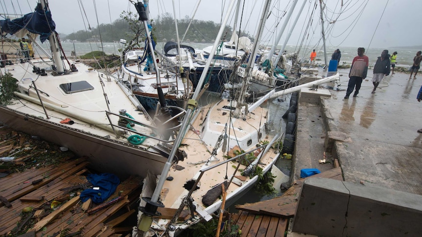 Several boats are cracked and damaged in the wake of a Tropical Cyclone.