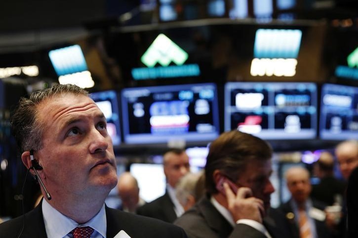 Traders work on the floor of the New York Stock Exchange (NYSE) shortly after the opening bell in New York.