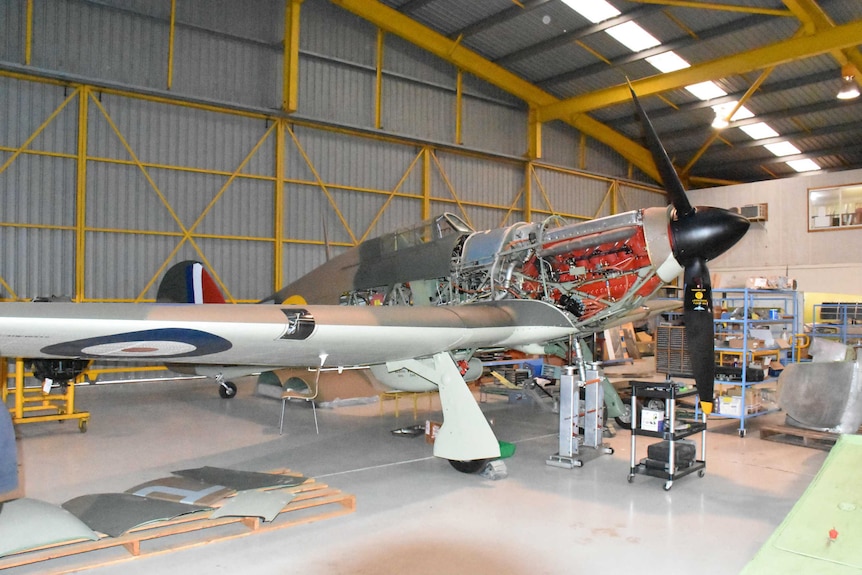 Hawker Hurricane plane in a hangar after being repainted.
