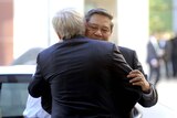 Indonesia President Susilo Bambang Yudhoyono (right) hugs Australian Prime Minister Kevin Rudd