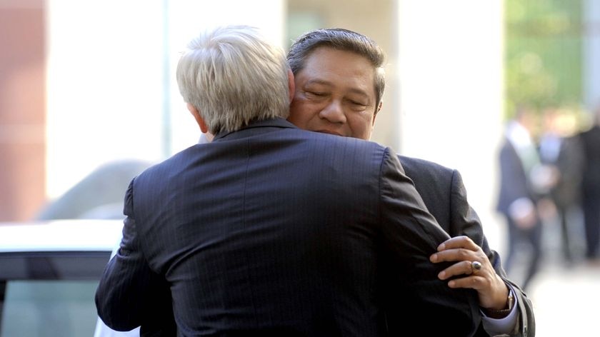 Indonesia President Susilo Bambang Yudhoyono (right) hugs Australian Prime Minister Kevin Rudd
