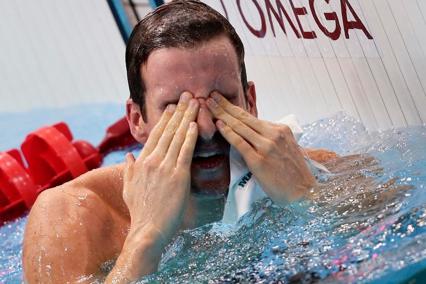 Shattering... James Magnussen wipes his eyes after being pipped by a hundredth of a second.