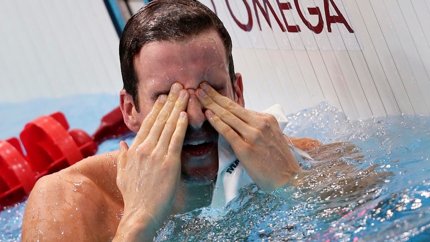 James Magnussen wipes his eyes after coming second in the men's 100m freestyle final by 1/100th sec.