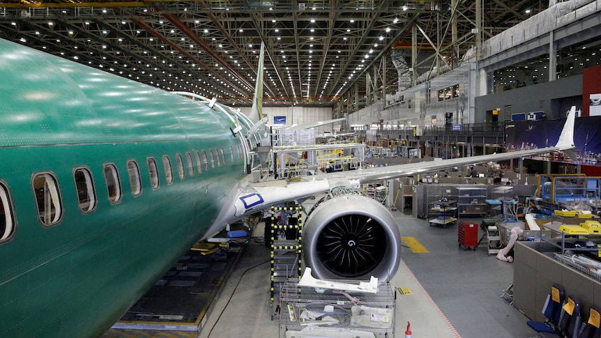 A Boeing 737 MAX 9 sits under construction in a production facility in the US