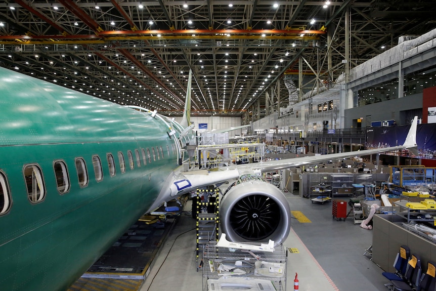 A Boeing 737 MAX 9 sits under construction in a production facility in the US