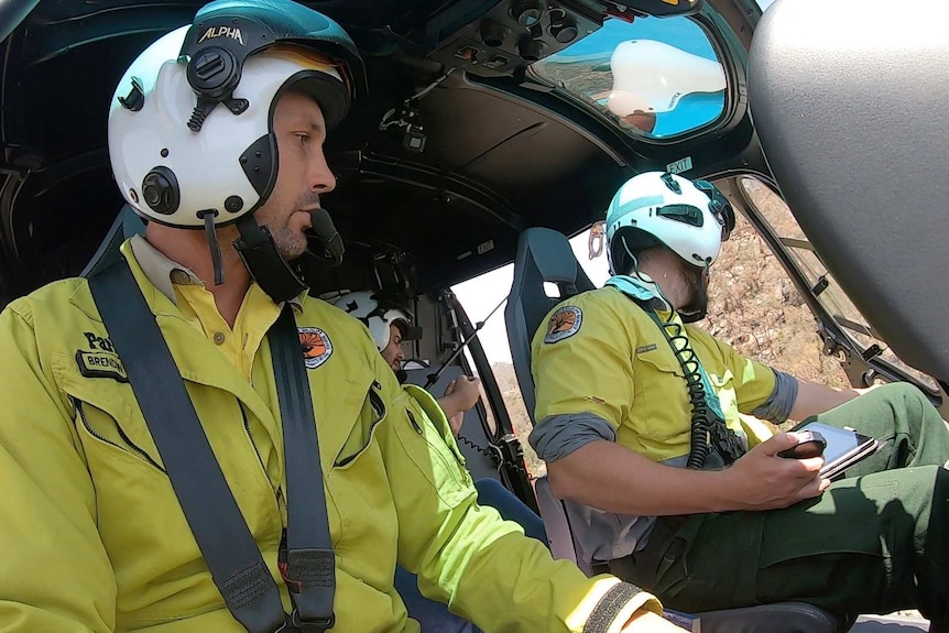Two helicopter pilots in their cockpit
