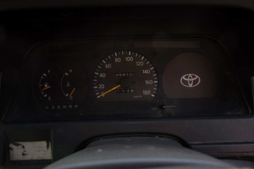 Close up of an odometer reading 694132