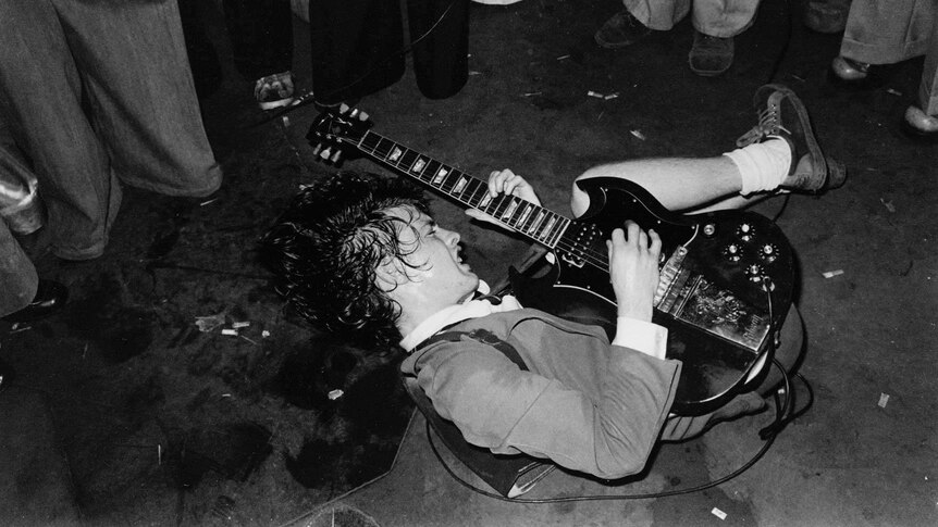 Angus Young performs Baby Please Don't Go on the floor of the Hard Rock café in Melbourne.