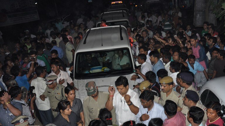 Protesters block the convoy of West Bengal chief minister Mamata Banerjee as she attempts to visit the nun.