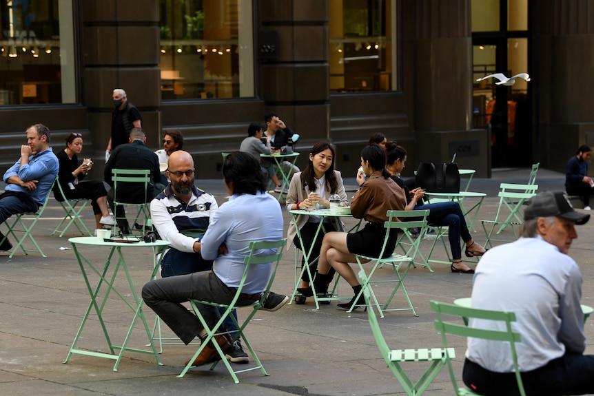 People sit in Sydney CBD