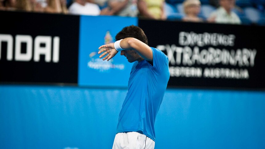 High praise ... Bernard Tomic takes a break during his win over Tommy Haas