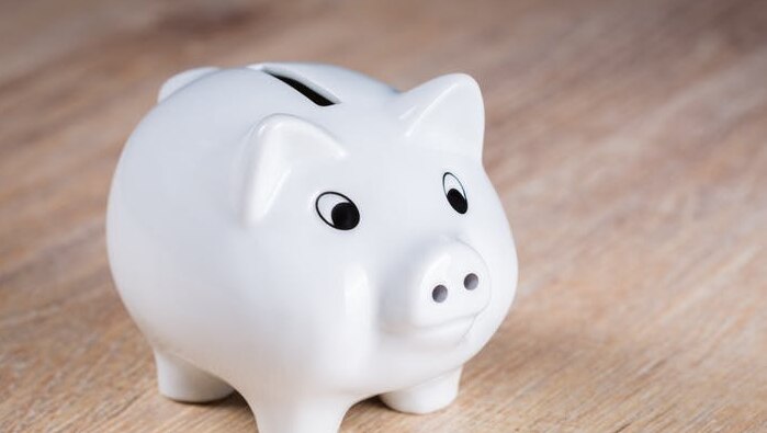 Image of white piggy bank on table