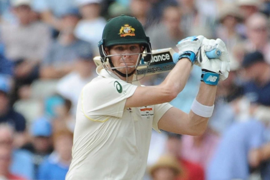 Australia batsman Steve Smith finishes a swing of his cricket bat in an Ashes Test.