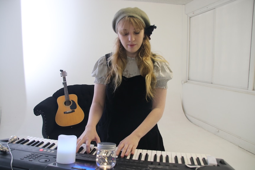Grace Newton-Wordsworth  playing keyboard.
