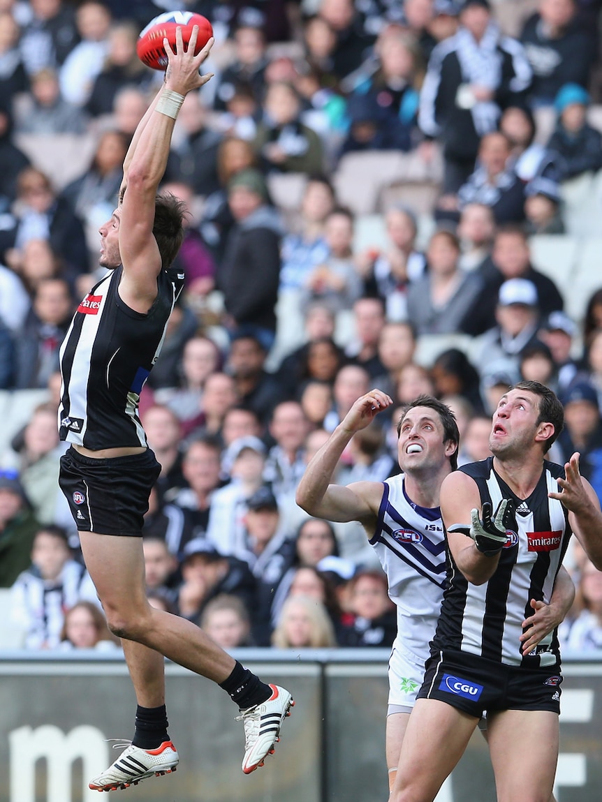 Collingwood's Dale Thomas makes a trademark leap against the Dockers.