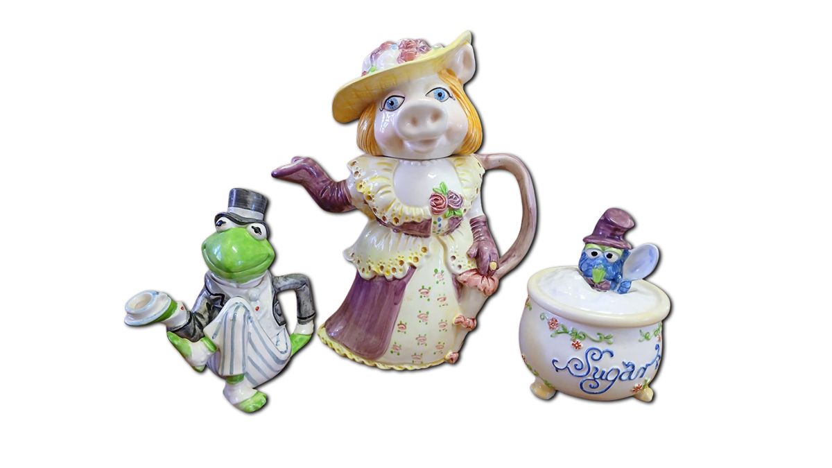 a miss piggy teapot, kermit milk jug and gonzo sugar bowl
