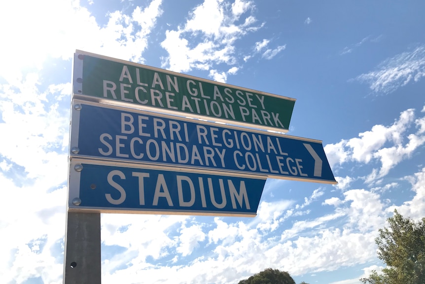 A pole with three signs, one for Alan Glassey Recreation Park, another Berri Regional Secondary College and one for a Stadium.