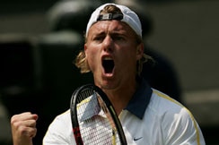 Lleyton Hewitt gets pumped up during his four-set win over Taylor Dent