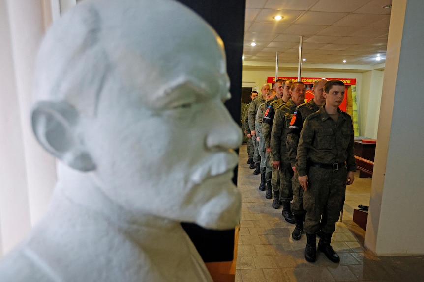 Soldiers line up to vote during a referendum