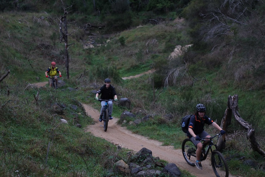 Dylan Beetin in bike ahead of Jackson Wooldridge and Constable David Simpson.