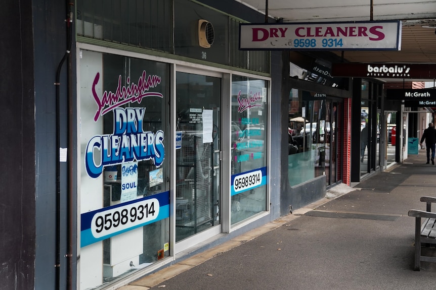 A shopping strip with the Sandringham Dry Cleaners store in focus.