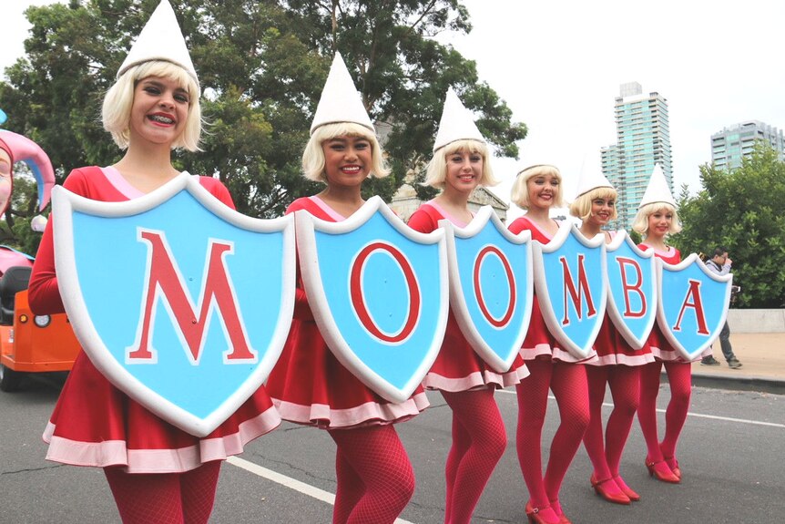 A group of children hold a Moomba sign ahead of the parade.