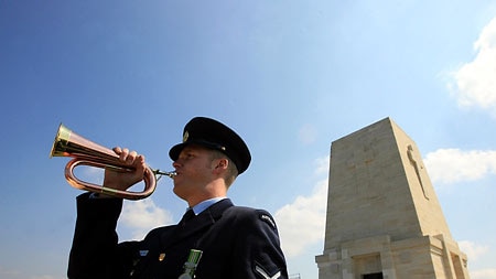 An Australian soldier blows a trumpet at an Anzac Day ceremony in Gallipoli.