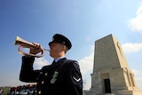 An Australian soldier blows a trumpet at an Anzac Day ceremony in Gallipoli.