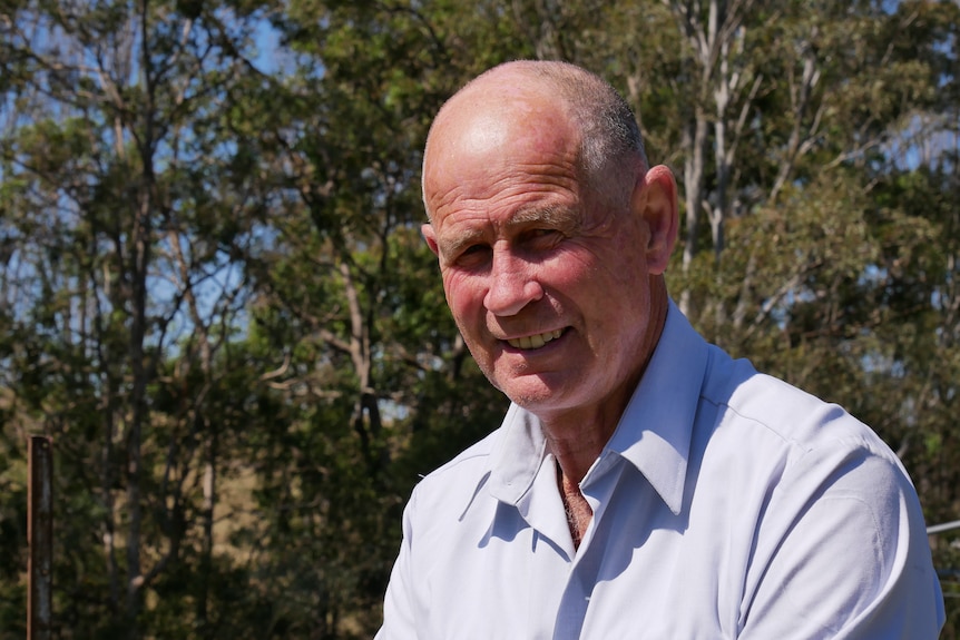 a man smiles at the camera