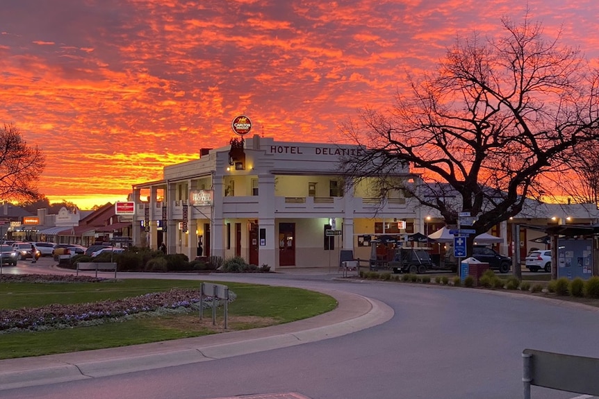 Exterior of a hotel at sunset.