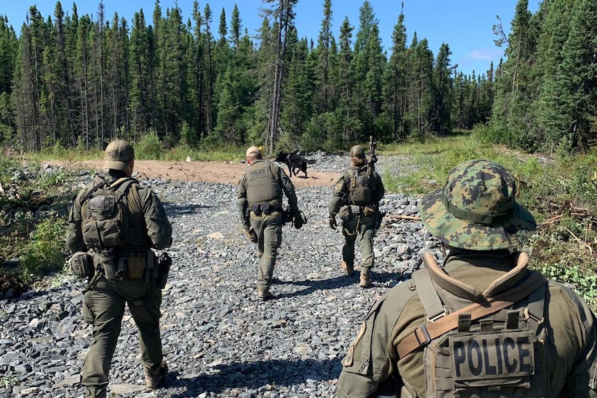 A crew of four police search remote Canadian bushland for fugitives.